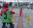 Children learning the rules of the road during a cycling class (Kobe)