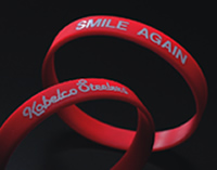 Wristbands with the inscription SMILE AGAIN