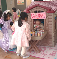 Playing store keeper in a play house (Ogaki)