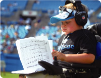Child realizing his dream of becoming a pro football coach