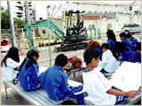 Children sketching an excavator at the Gifu Training Center