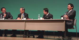 A panel discussion session featuring Takeshi Okada, former coach of Japan's national soccer team