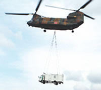Moving a power-supply vehicle via helicopter