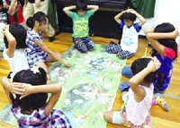 Children playing eco card game