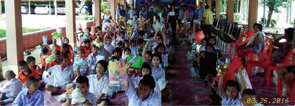 Children holding up presents